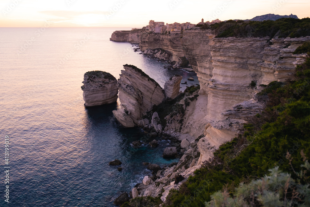 Sunset on the cliffs of Bonifacio in October, with the city of Bonifacio which overlooks the sea from 100 meters high.