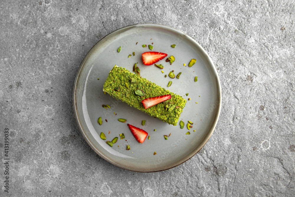 Pistachio cheesecake with strawberries. Delicious airy dessert. Pistachio cheesecake with strawberries. Delicious airy dessert.