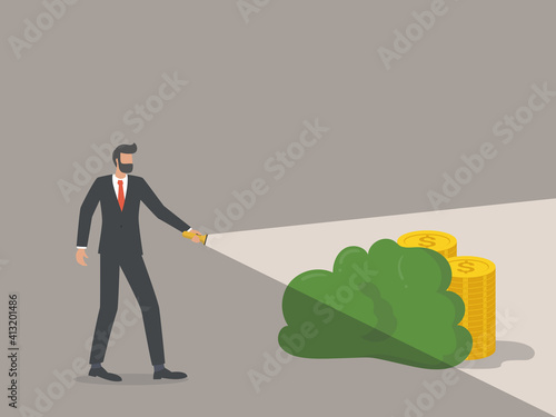 hidden cost concept, businessman looking for coins hidden in the dark using a flashlight