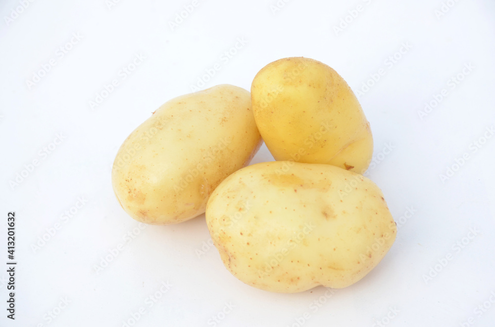 the yellow ripe potato isolated on white background. the yellow ripe potato isolated on white background.