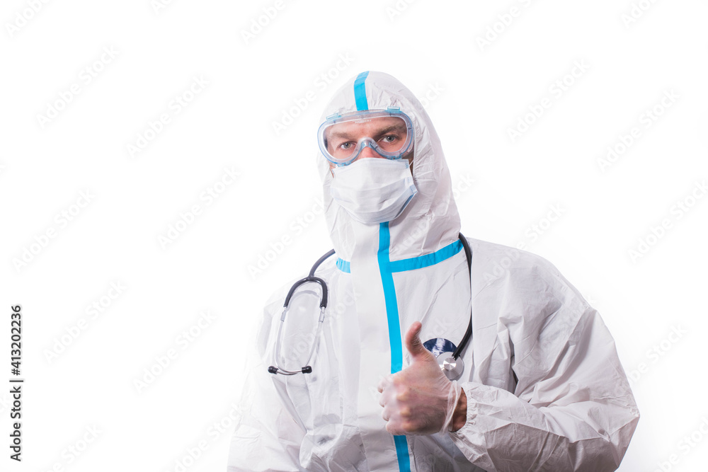 Man in protective suit, medical mask, goggles with arms crossed. Isolated in studio Man in protective suit, medical mask, goggles with arms crossed. Isolated in studio