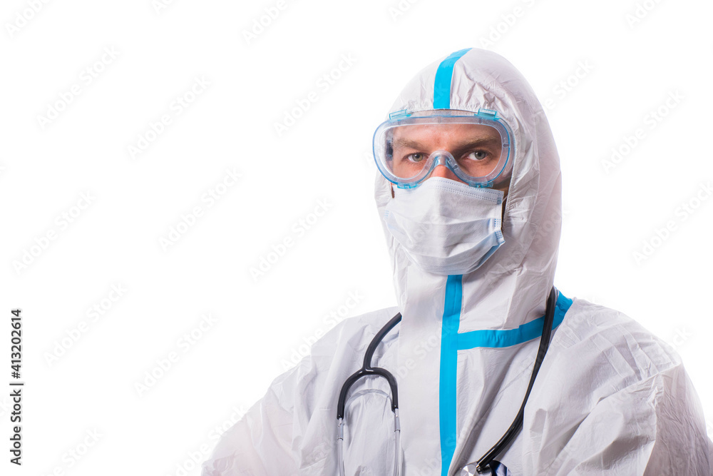 Man in protective suit, medical mask, goggles with arms crossed. Isolated in studio Man in protective suit, medical mask, goggles with arms crossed. Isolated in studio