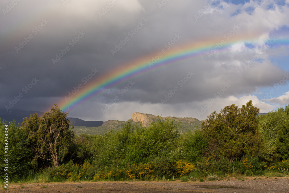 Rainbow view over the Andes mountain in Los Alerces National Park, Patagonia, Argentina	