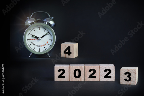 2022 to 2024 with alarm clock on black background, time for change concept and business success idea