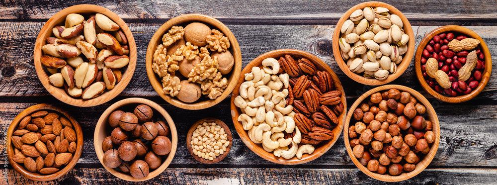 Various Nuts in wooden bowls. Various Nuts in wooden bowls.