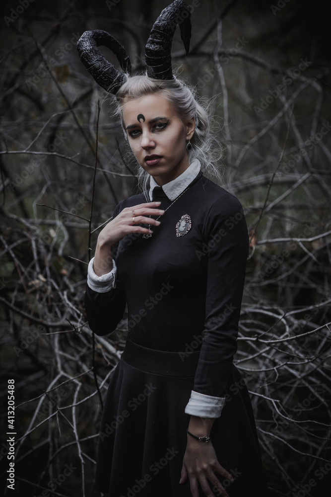 Naklejka premium Witch in the form of a student in the forest