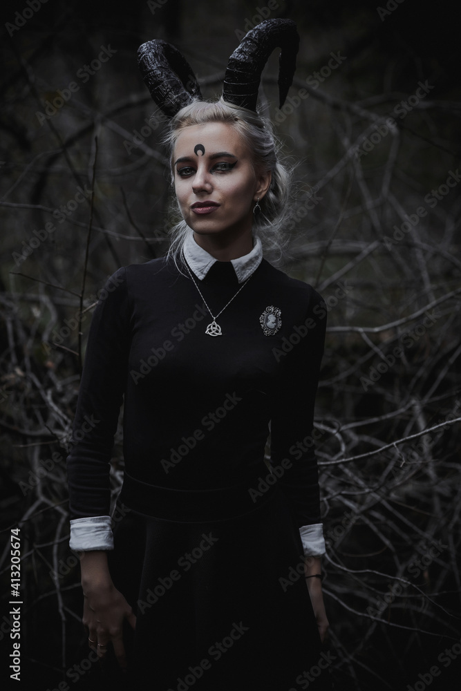 Naklejka premium Witch in the form of a student in the forest