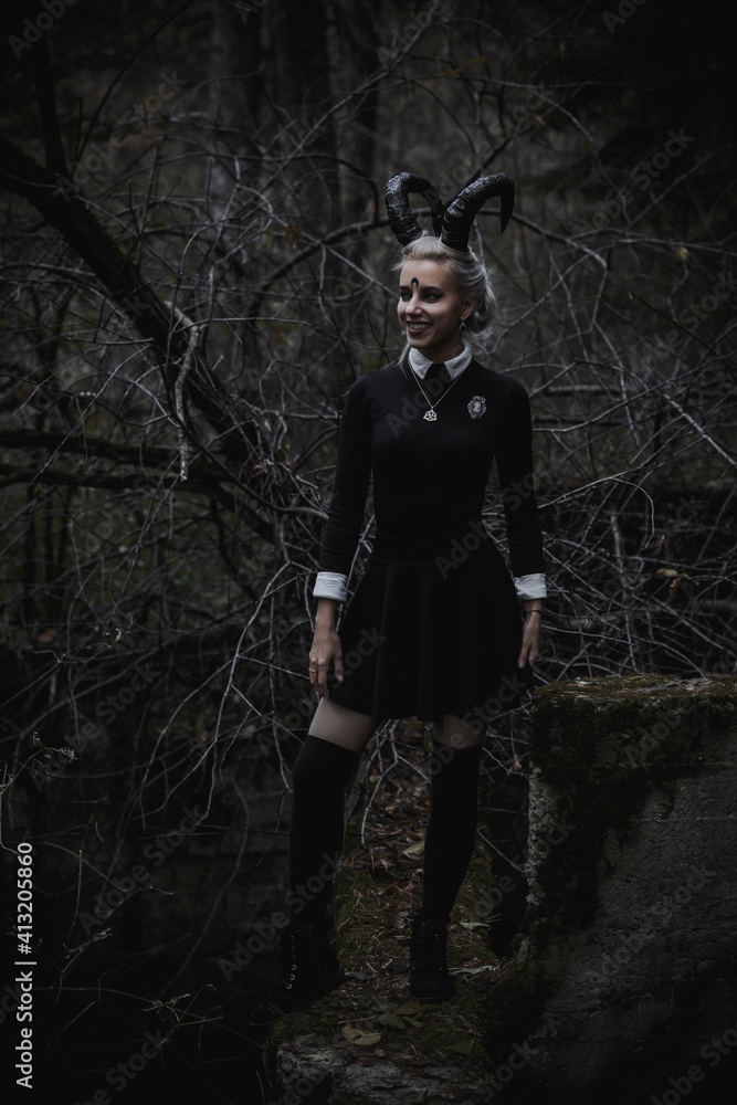 Naklejka premium Witch in the form of a student in the forest