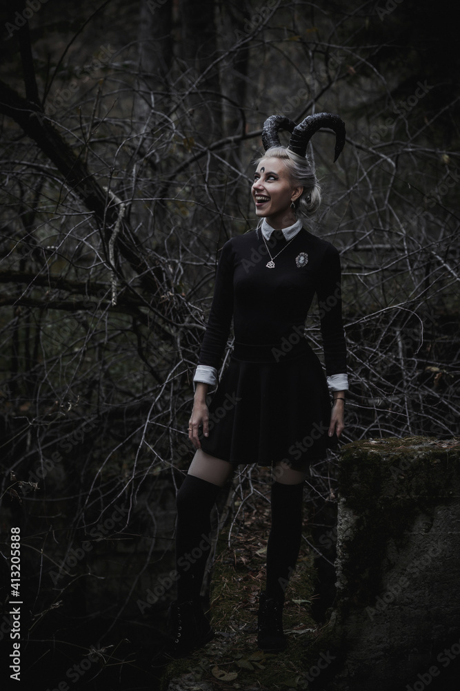 Naklejka premium Witch in the form of a student in the forest