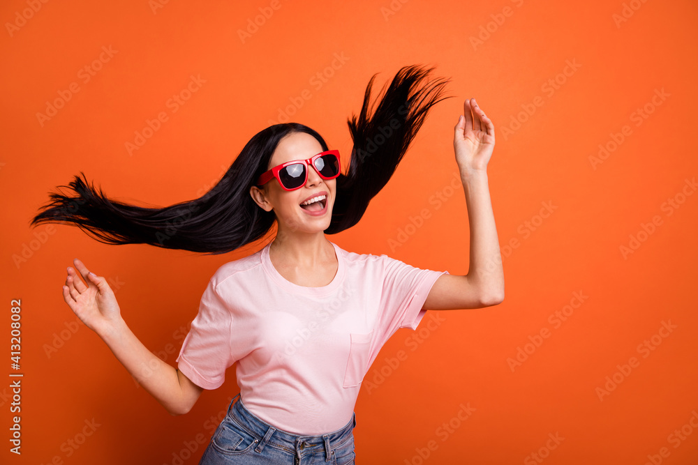 Photo of impressed brunette lady arms up wear spectacles pink t-shirt isolated on bright orange color background