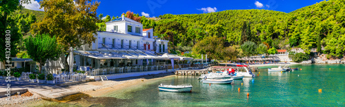 Best of Skopelos island - Picturesque fishing village Agnontas, with traditional tavernas on the beach. Sporades, Greece