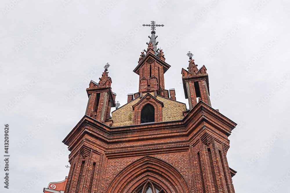 Red brick St. Anne's church (1500) - Flamboyant Gothic and Brick Gothic styles Roman Catholic Church in the Old Town of Vilnius. Lithuania.