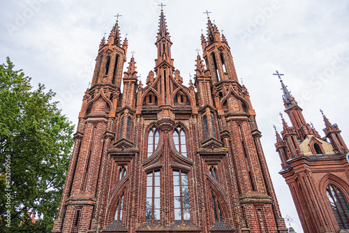 Red brick St. Anne's church (1500) - Flamboyant Gothic and Brick Gothic styles Roman Catholic Church in the Old Town of Vilnius. Lithuania.