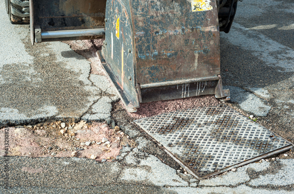 worker driver Skid steer remove Worn Asphalt during repairing Road Works