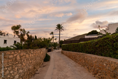 road leading to idyllic vacation homes on the Costa del Sol in Agua Amarga in Andalusia at sunset