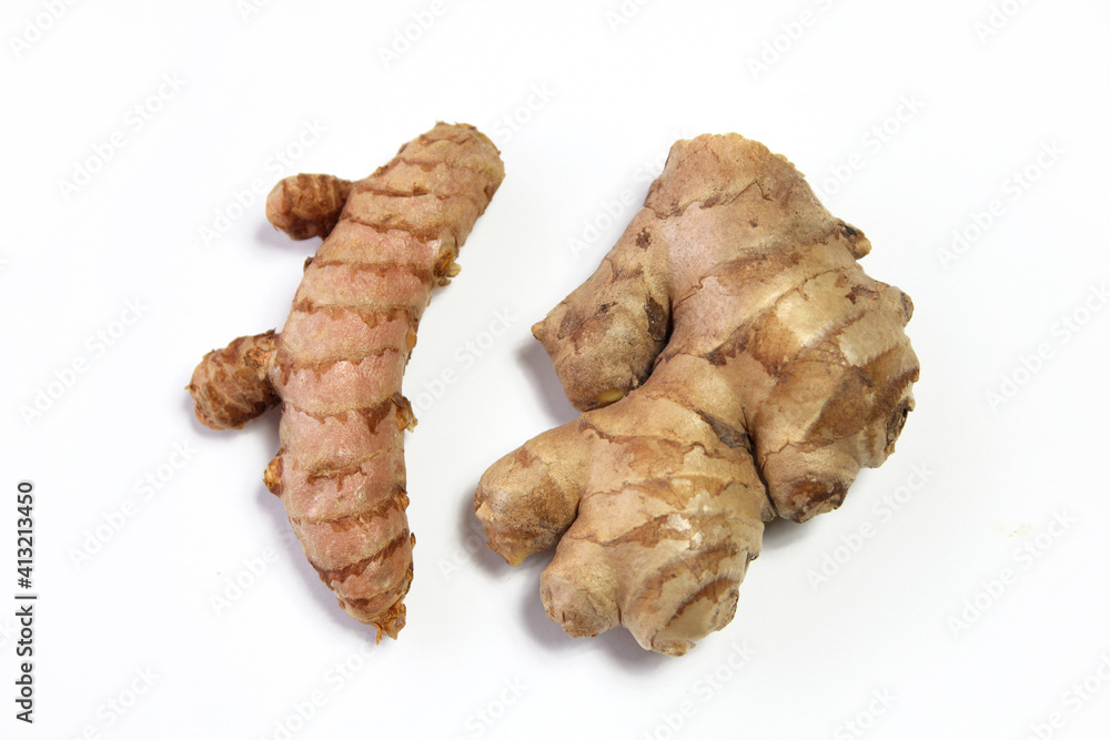 Turmeric root and ginger root on a white background Turmeric root and ginger root on a white background