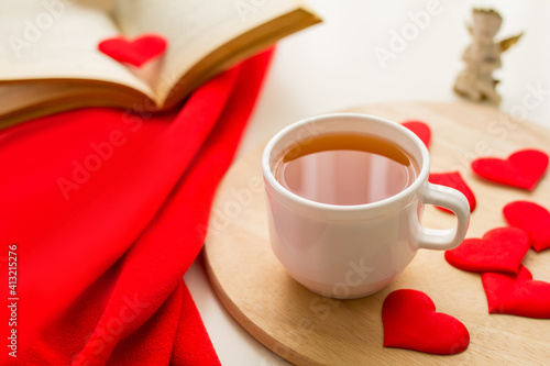 Love concept, cake and heart on a plate and cup of tea, valentine's day, hearts. 