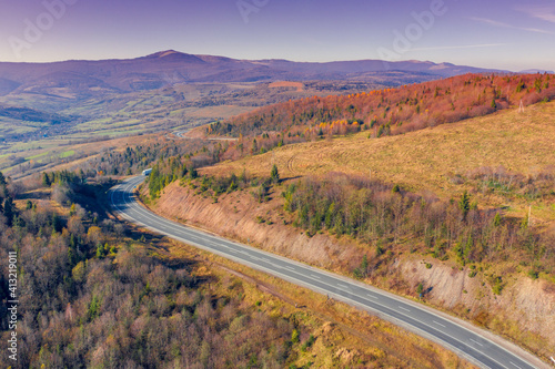 Winding highway in the autumn mountains. Drone view. Beautiful natural landscape. The Carpathians. Ukraine