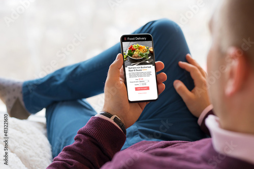 Man choosing a meal on food delivery app