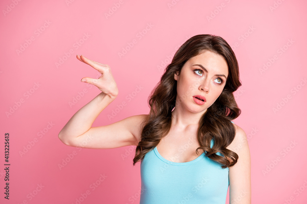 Portrait of ignored sad brunette long hair style girl show bla bla bla sign wear blue top isolated on pink color background Portrait of ignored sad brunette long hair style girl show bla bla bla sign wear blue top isolated on pink color background