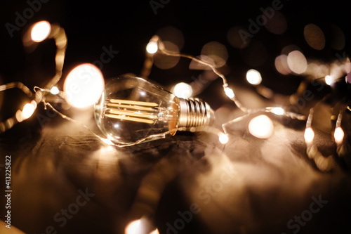 Fototapeta Naklejka Na Ścianę i Meble -  light bulb filament idea background. Energy lamp illumination filament. Invention idea