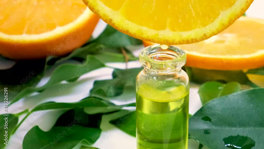 essential oil of orange in small bottles. selective focus. essential oil of orange in small bottles. selective focus.
