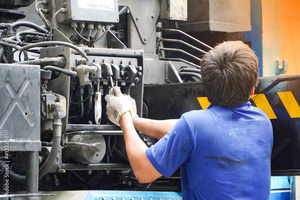 Asian workers control cranes.Crane Operator
Asian workers control cranes.Crane Operator