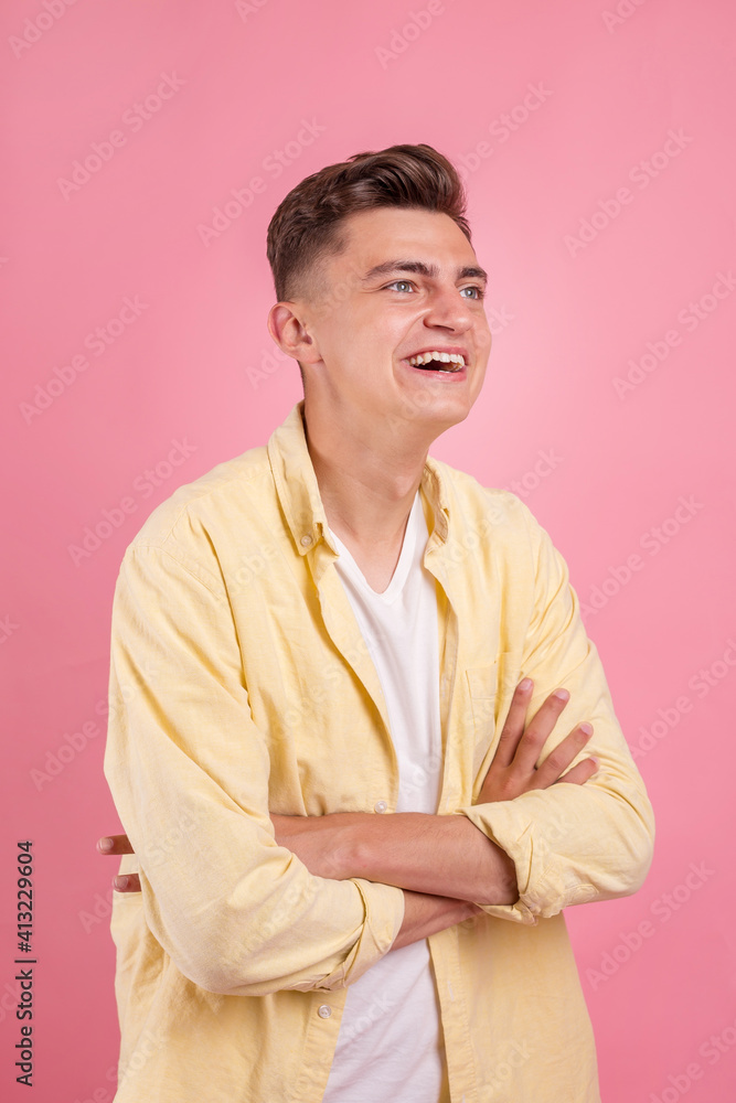 Portrait of a satisfied young man celebrating success isolated over pink background Portrait of a satisfied young man celebrating success isolated over pink background