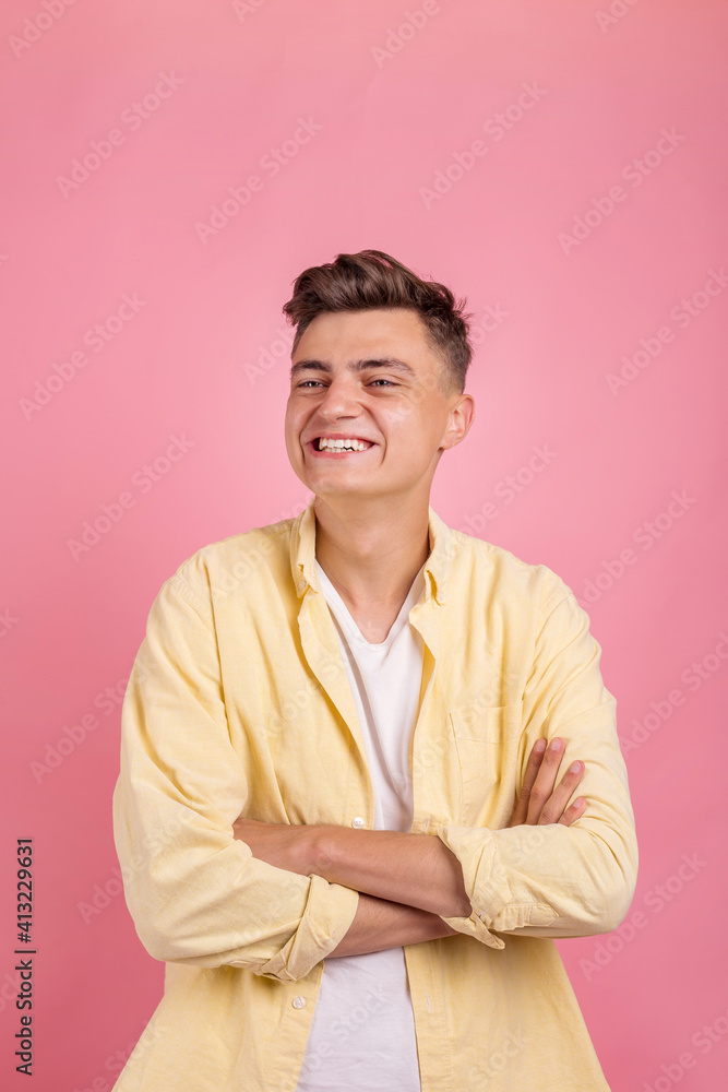 Portrait of a satisfied young man celebrating success isolated over pink background Portrait of a satisfied young man celebrating success isolated over pink background
