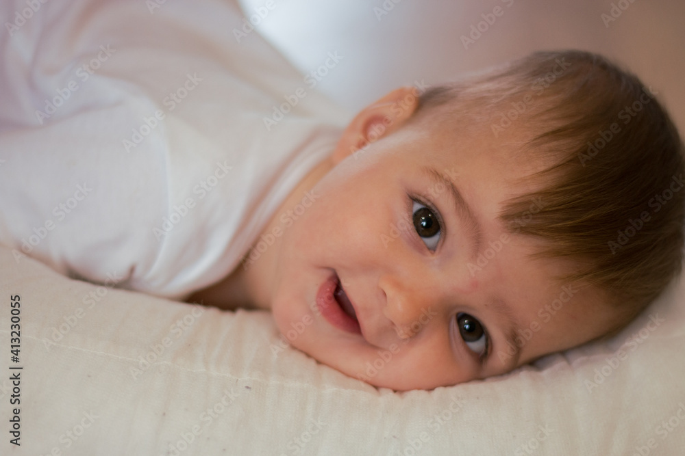 portrait of a smiling baby looking straight at the camera portrait of a smiling baby looking straight at the camera