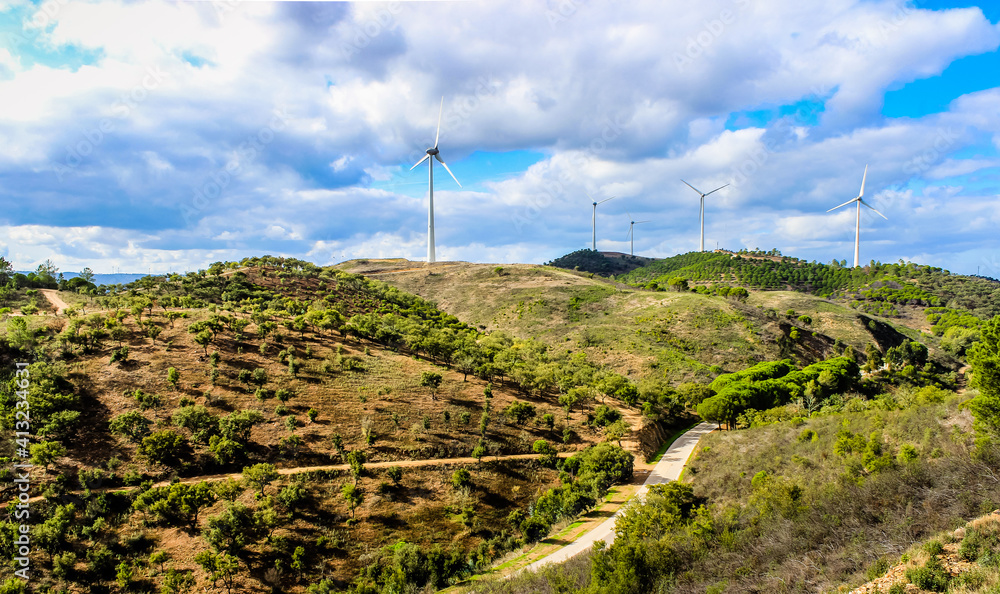 Sustainable Lifestyle and green energies. Windmills in the Algarve hills - Portugal