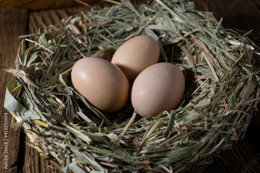 Easter basket with eggs. eggs in a straw nest Easter basket with eggs. eggs in a straw nest