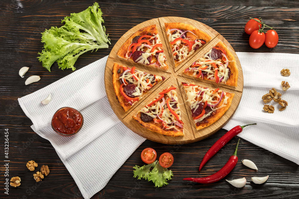 Delicious pizza on a wooden cutting board