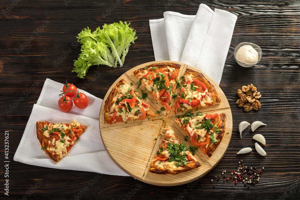 Delicious pizza on a wooden cutting board