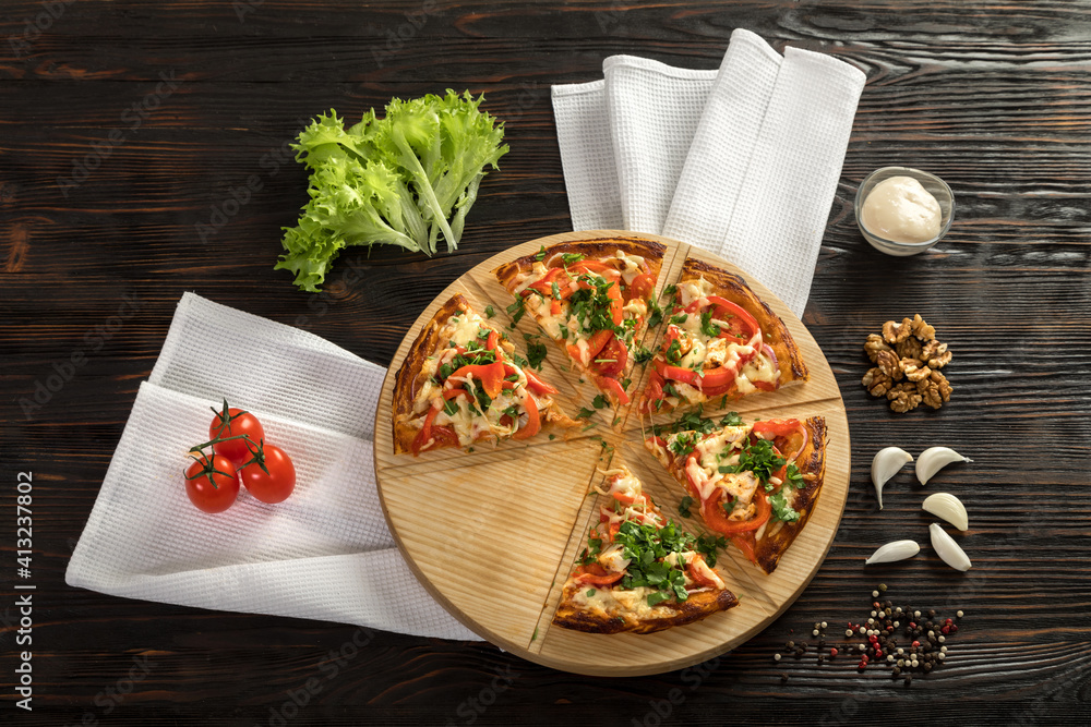 Delicious pizza on a wooden cutting board