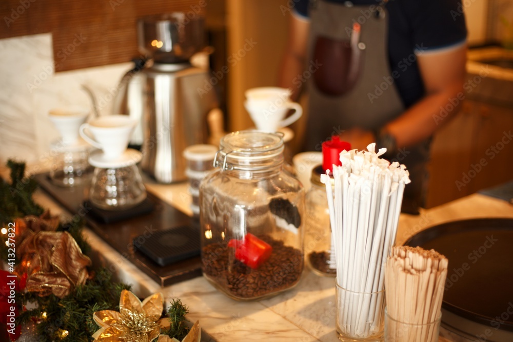 Coffee shop table, straws, coffee beans, drip coffee, barista
