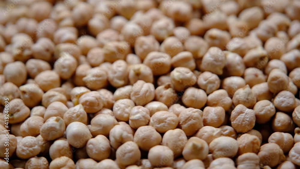 The rotation of the texture of chickpeas. Background. Rotating a plate of chickpeas. solid background, close-up. The rotation of the texture of chickpeas. Background. Rotating a plate of chickpeas. solid background, close-up.