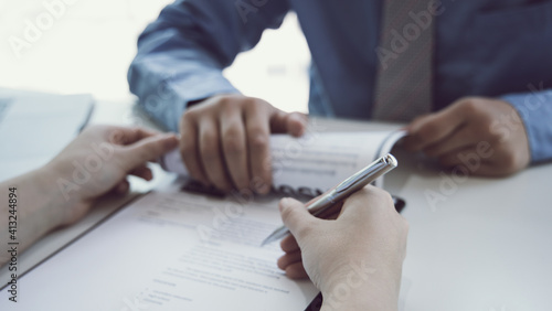 Job seeker has signed an employment contract with the employer or company HR, Signing a contract for applying for a job, Agreeing to the terms and conditions of the law.