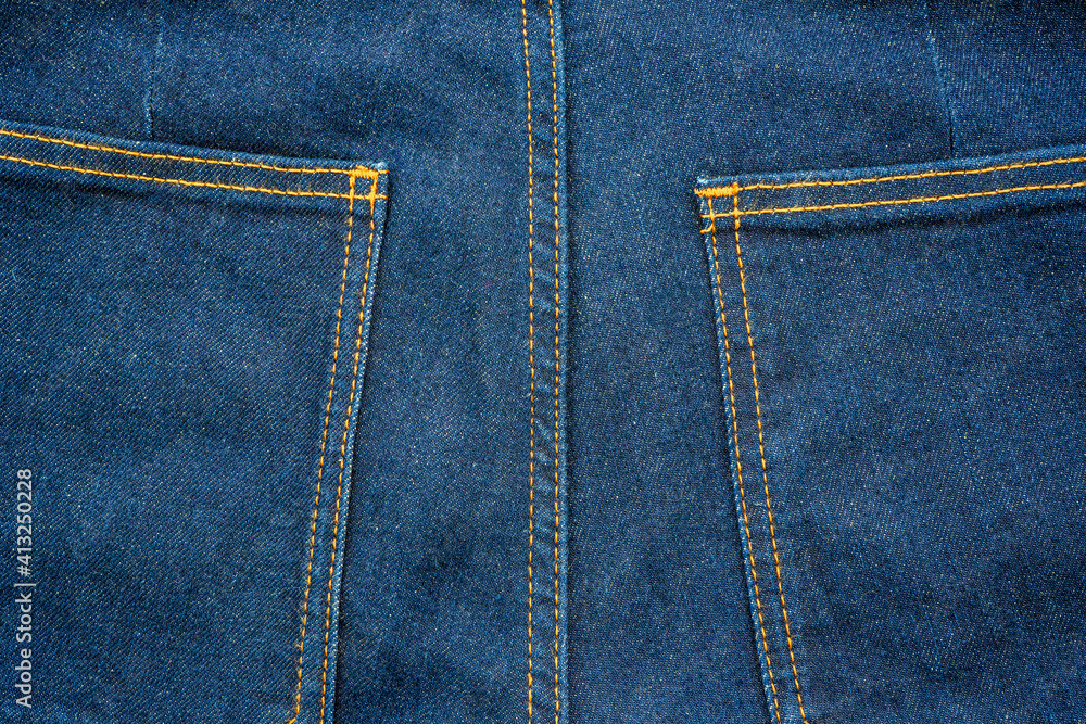 Backside denim blue jeans pocket closeup. Denim jeans texture. Blue jeans texture with pocket for any background. High quality photo Backside denim blue jeans pocket closeup. Denim jeans texture. Blue jeans texture with pocket for any background. High quality photo