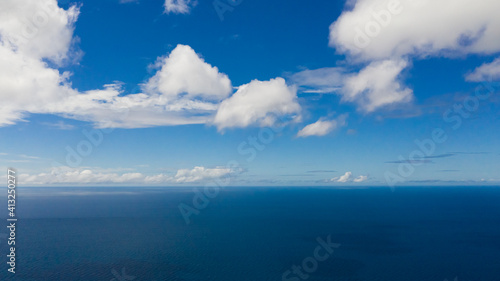 Aerial seascape of Blue sea and sky with clouds. Summer and travel vacation concept. Flight over the sea.