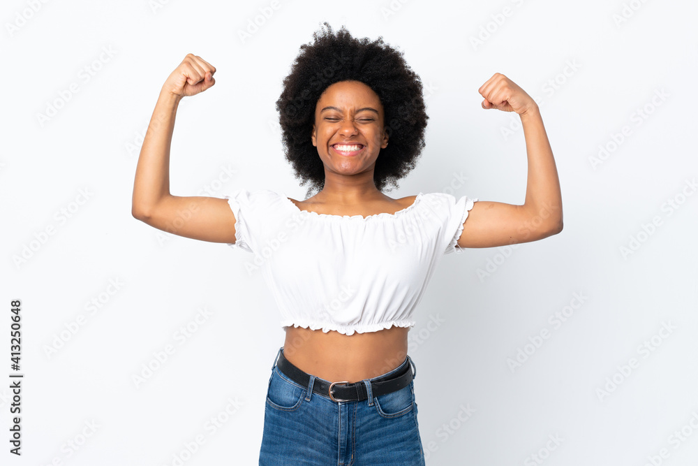 Young African American woman isolated on white background doing strong gesture Young African American woman isolated on white background doing strong gesture