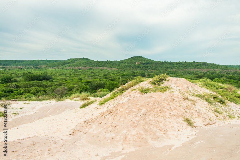 A view of Morro branco (White mountain) and lush caatinga forest in the rainy season (Oeiras, Piaui - Northeast Brazil) A view of Morro branco (White mountain) and lush caatinga forest in the rainy season (Oeiras, Piaui - Northeast Brazil)