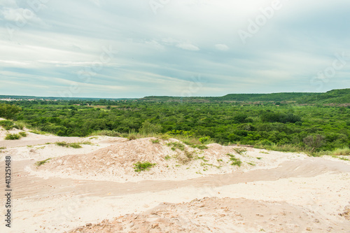 A view of Morro branco  White mountain  and lush caatinga forest in the rainy season  Oeiras  Piaui - Northeast Brazil 