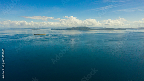 Seascape with blue sea and Islands.Sea against a blue sky with clouds. Mindanao, Philippines.