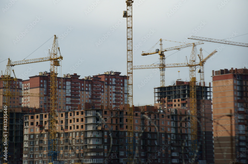 Houses under construction in a residential complex. Houses under construction in a residential complex.