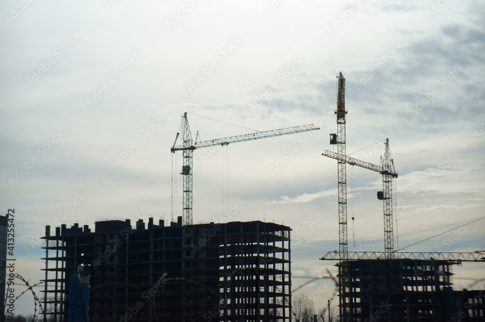 Houses under construction in a residential complex. Houses under construction in a residential complex.