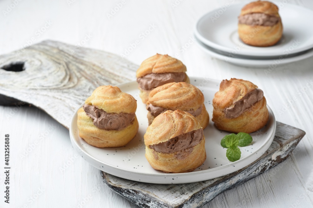 Choux pastry or Cream puffs filled chocolate custard.white background Choux pastry or Cream puffs filled chocolate custard.white background