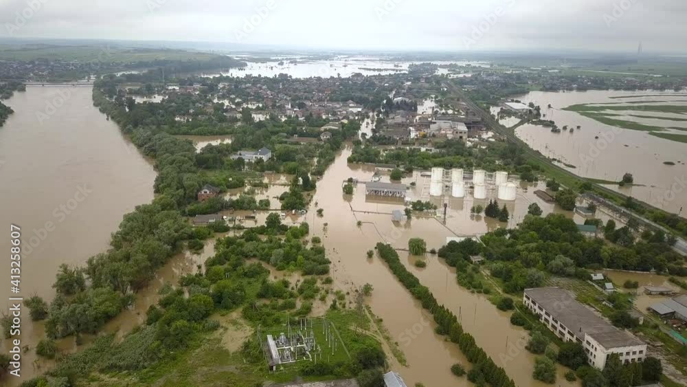 Aerial view of flooded houses with dirty water of Dnister river in Halych town, western Ukraine. Aerial view of flooded houses with dirty water of Dnister river in Halych town, western Ukraine.
