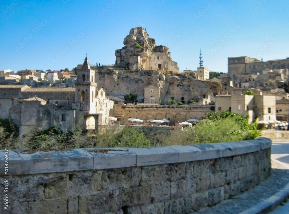 View of stone houses and basilica in the historic center of Matera. Basilicata. Italy. Europe