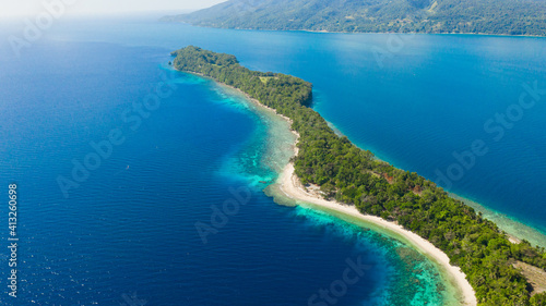Big Liguid Island with beautiful beach, palm trees by turquoise water view from above. Big Cruz Island, Philippines, Samal. © Alex Traveler